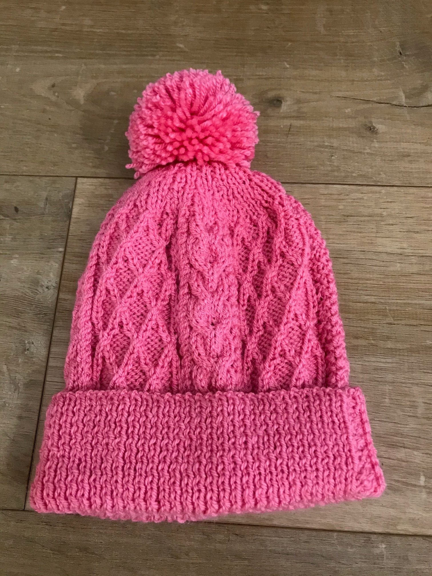 pink bobble hat